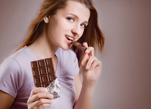 lady eating dark chocolate