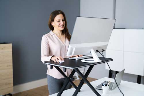 lady using standing desk