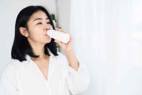 lady drinking yoghurt