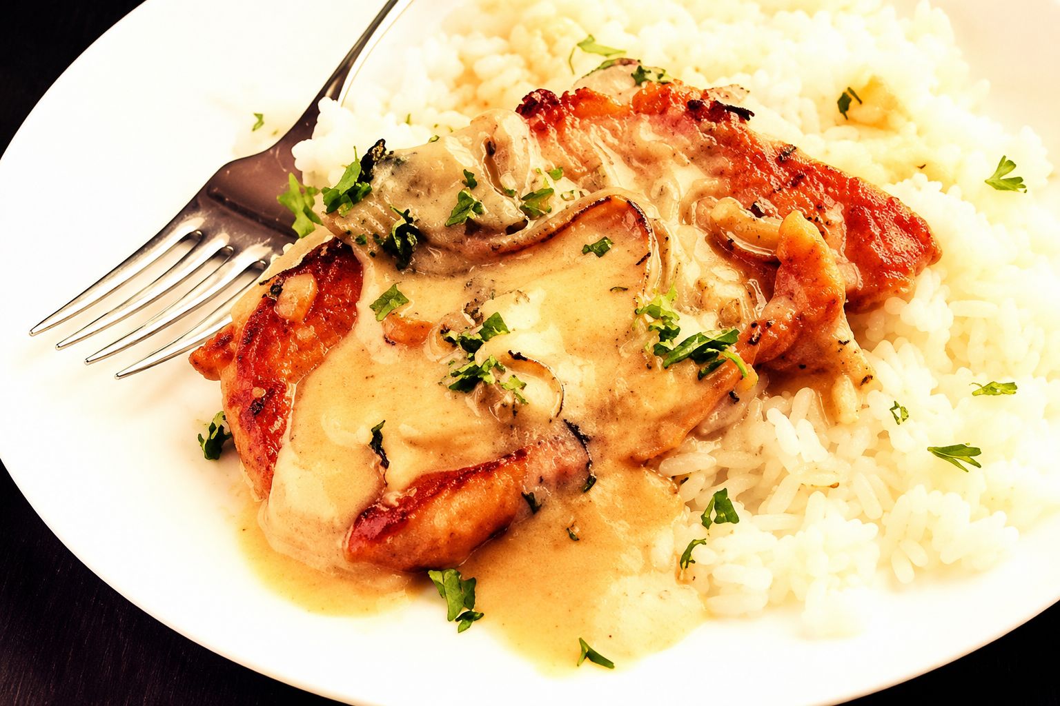 Creamy mustard pork chops with soft onions and sauce