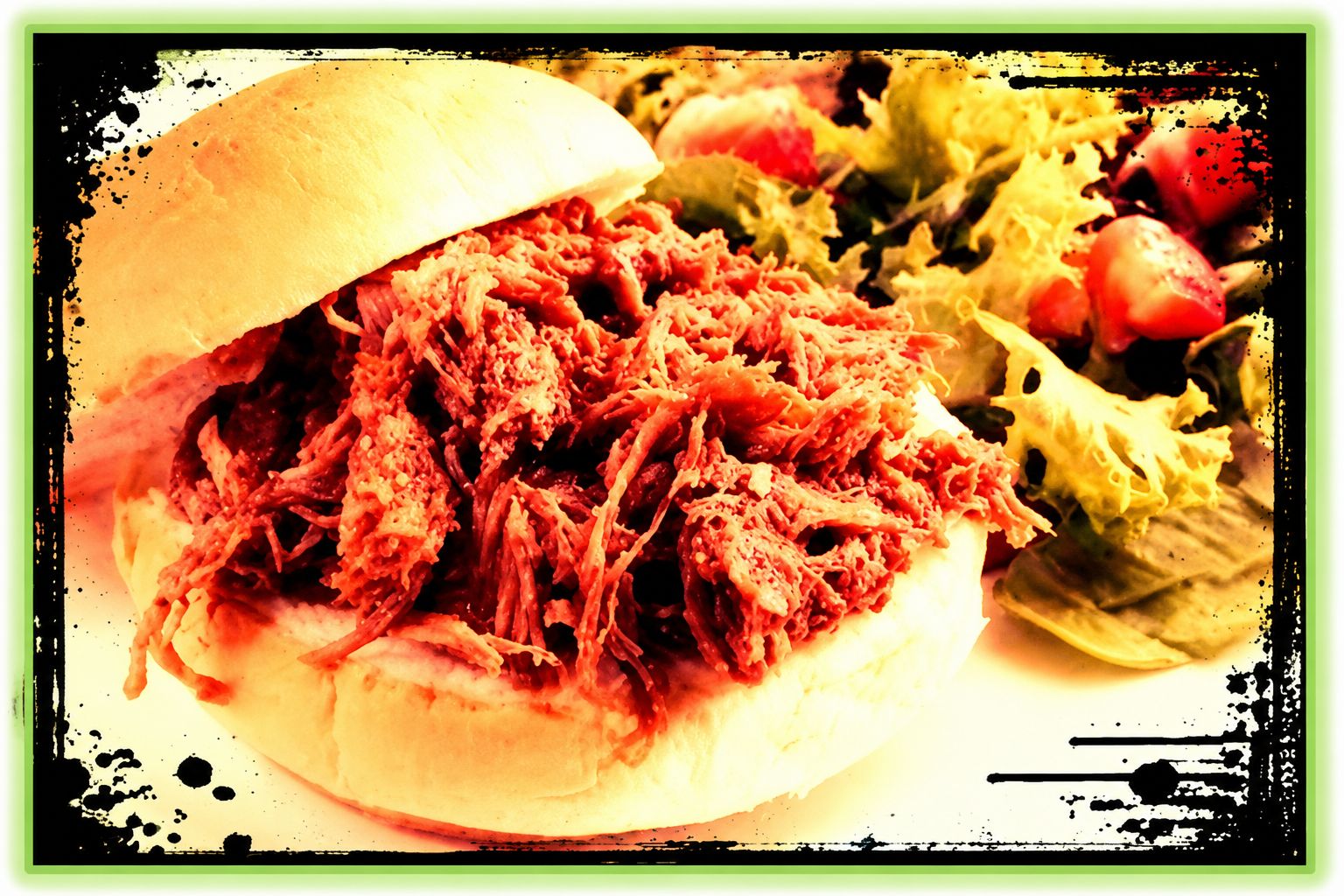 Shredded pulled pork with barbecue sauce on a bun