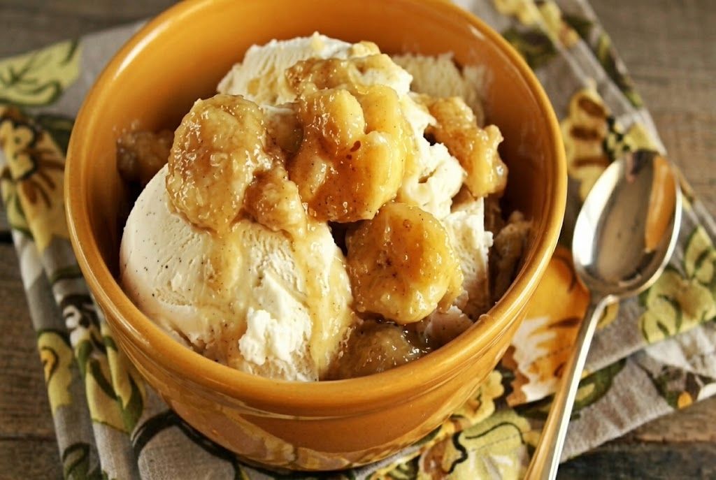 Warm bananas foster with brown sugar sauce and ice cream