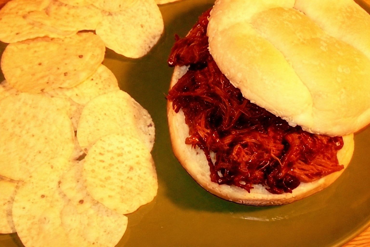 Cola barbecue pork roast shredded into saucy sandwiches