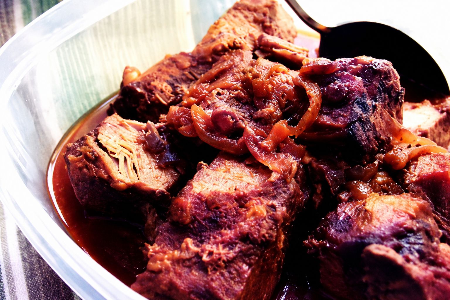 Slow cooked barbecue ribs coated in sticky dark sauce