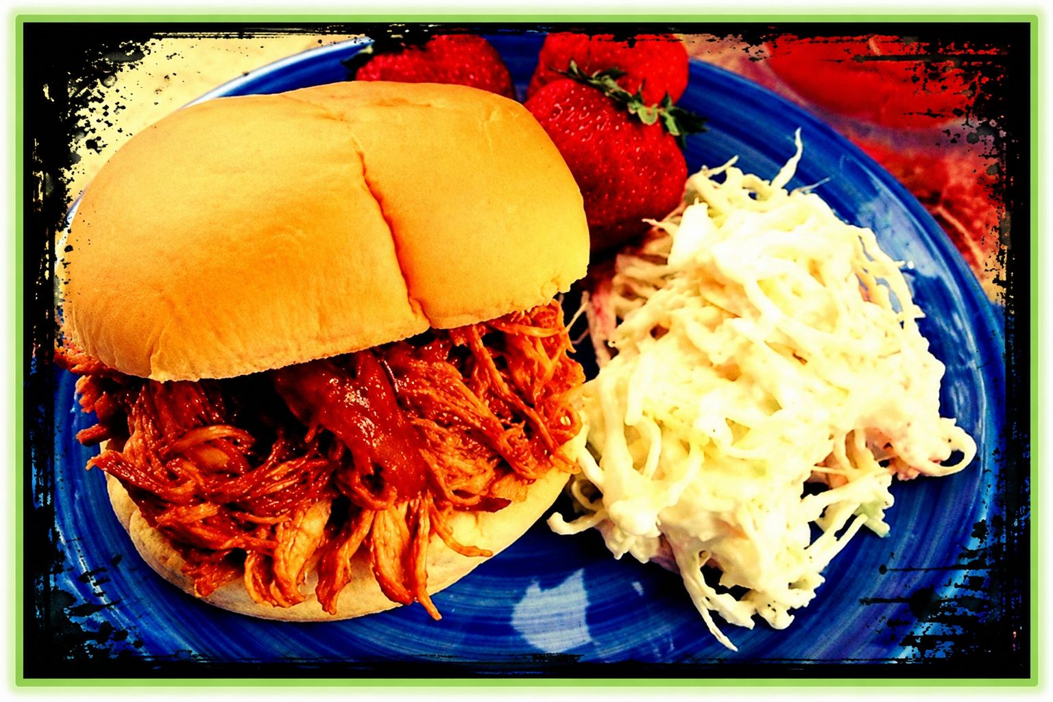 Shredded barbecue chicken piled onto soft sandwich buns