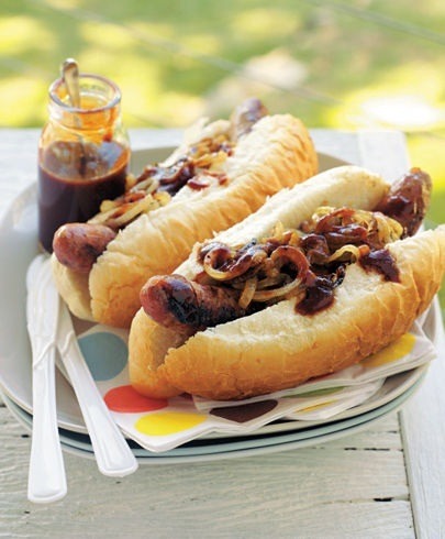 grilled hot dogs with onions and barbecue sauce