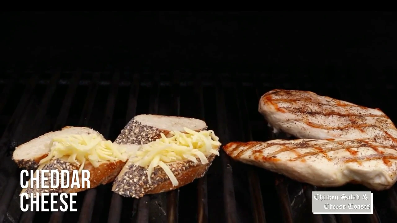 Seeded bread and cheddar cheese toasts on the grill
