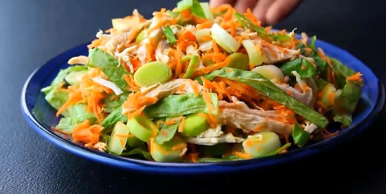 Finished chicken lettuce salad served in a bowl.