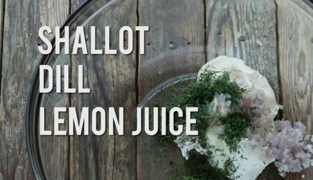 Adding shallot, dill, lemon juice, salt, and pepper to the creamy base.