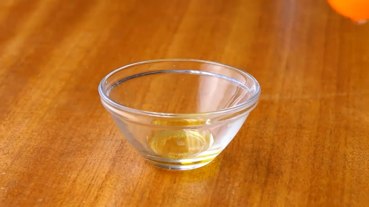Starting the lemon olive oil dressing for cucumber avocado salad.