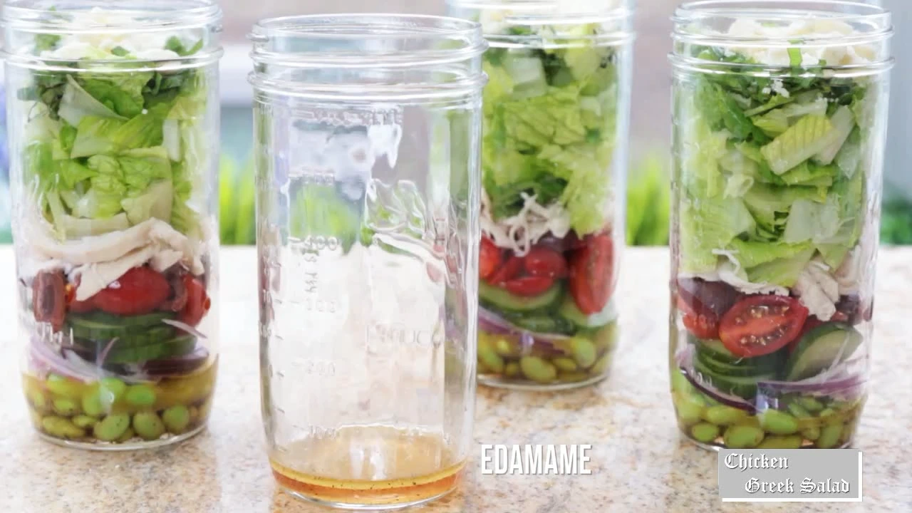Adding edamame to salad jars.