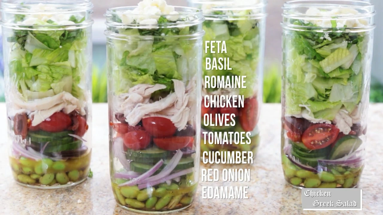 Topping jars with basil and feta.