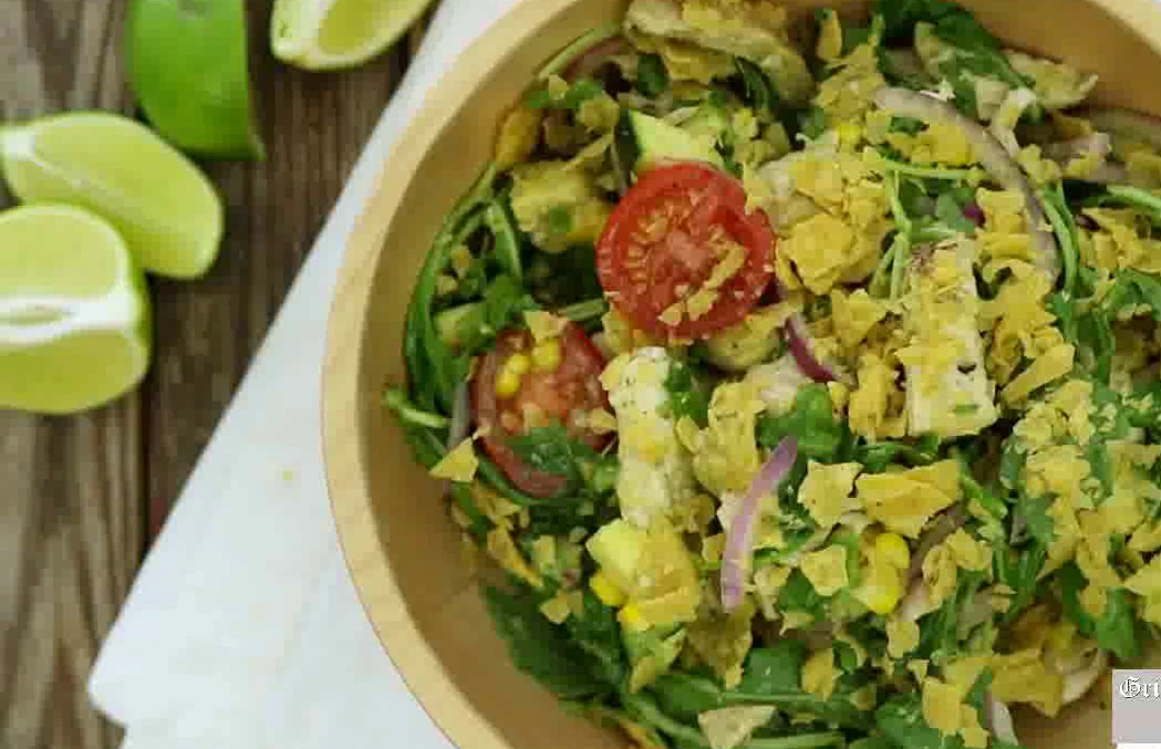 Finished grilled chicken taco salad served in a bowl.