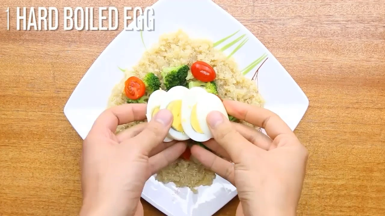 Adding sliced hard boiled egg to the salad.