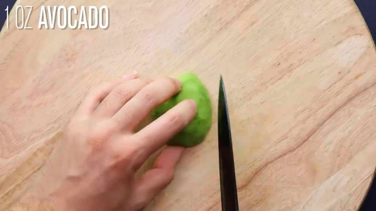 Adding avocado to quinoa salad.