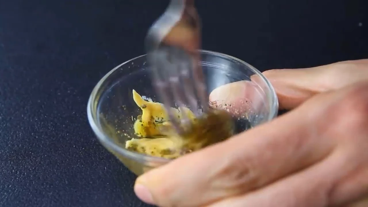 Whisking mustard dressing for quinoa salad.