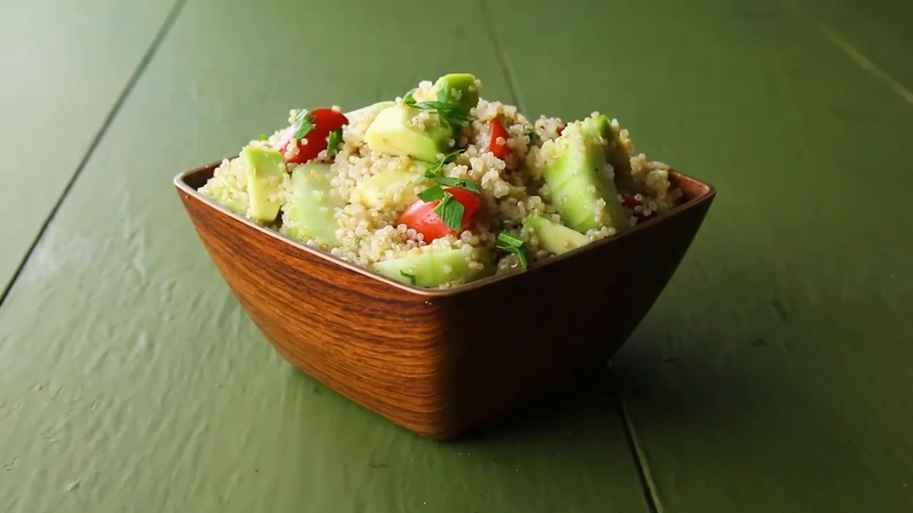 Finished quinoa salad with avocado ready to serve.