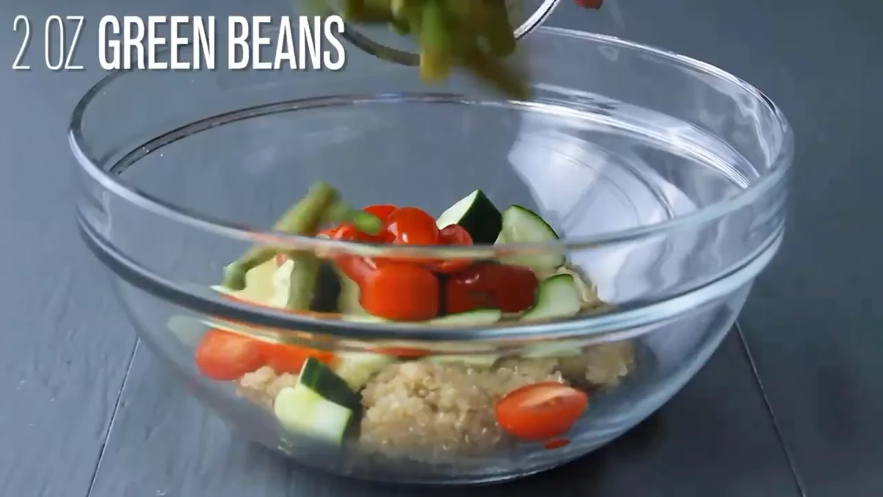 Adding green beans to quinoa salad with feta.