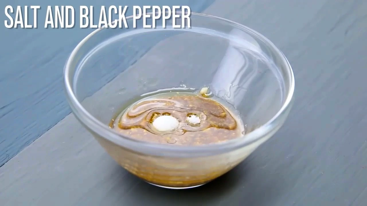 Balsamic mustard dressing being whisked together