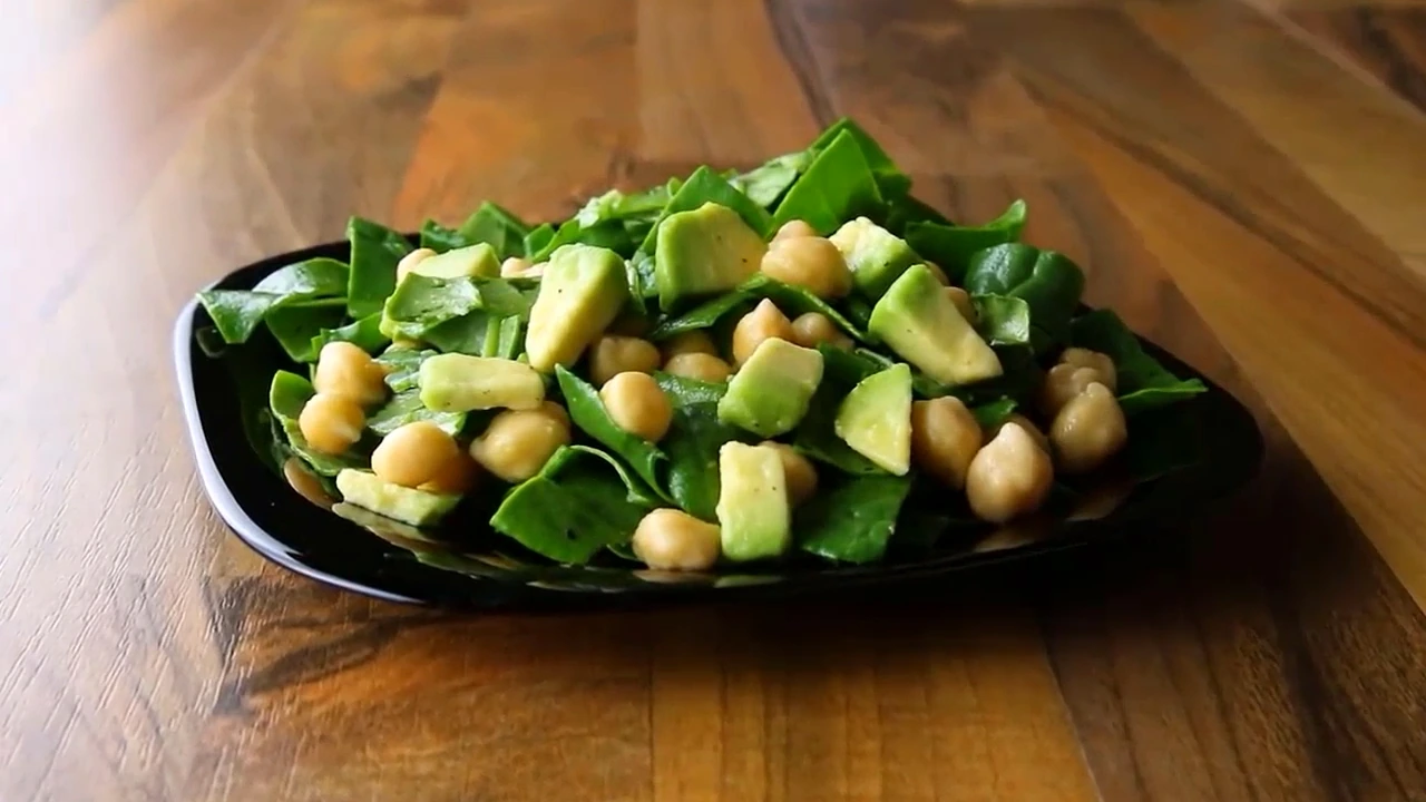 Finished spinach chickpea avocado salad plated for serving