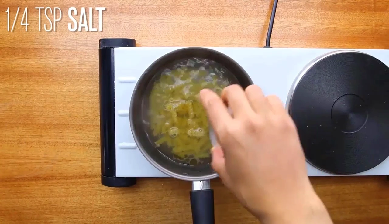 Cooking fusilli pasta in a small pan