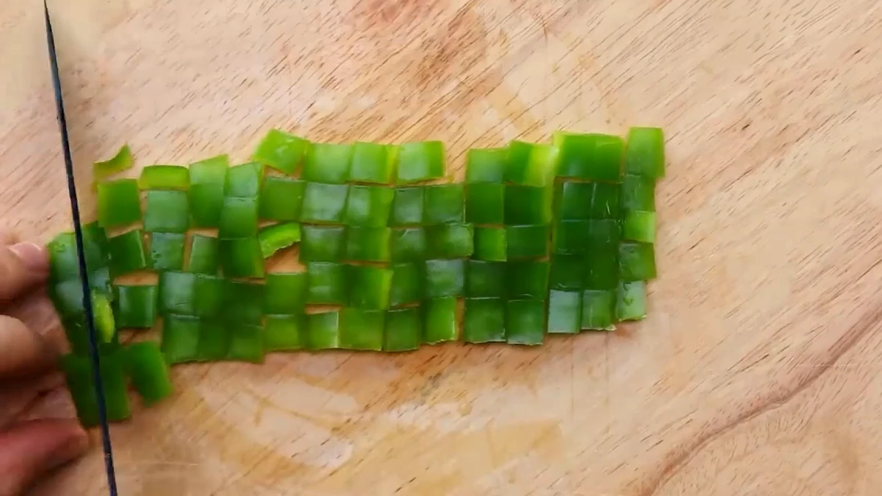 Chopping green pepper for spinach potato salad.
