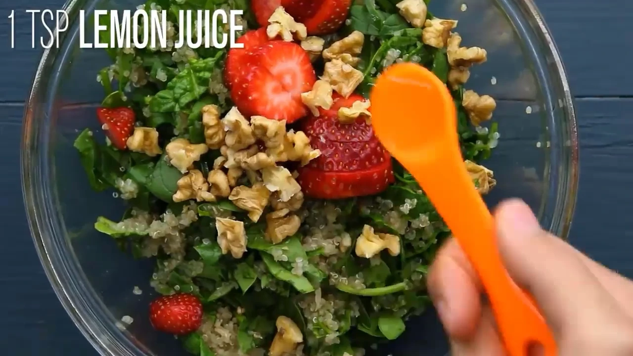 Drizzling lemon juice over the salad.