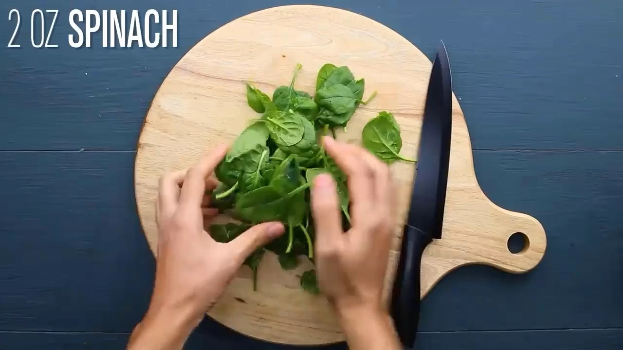 Spinach on a board ready to chop.