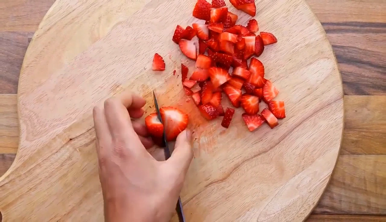 Dicing strawberries for strawberry spinach salad