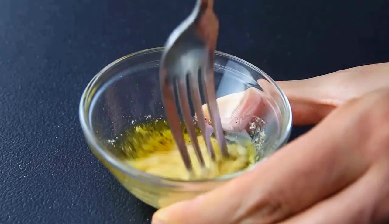 Whisking Dijon dressing for summer spinach and corn salad