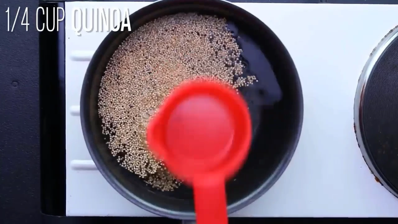 Cooking quinoa in a saucepan.