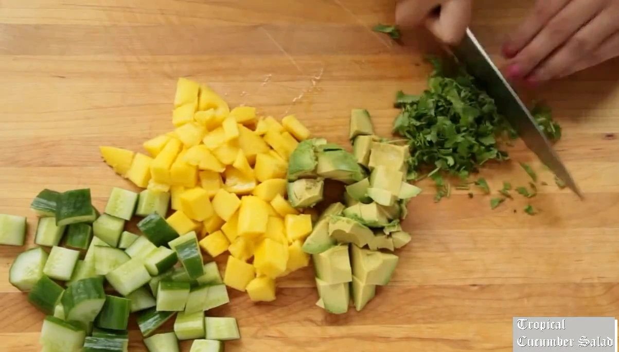 Chopping cilantro for tropical cucumber salad.
