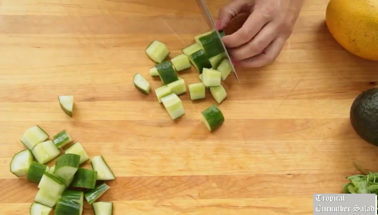 Chopping cucumber for tropical cucumber salad.
