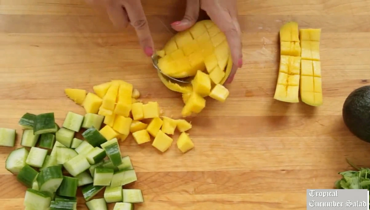 Dicing mango for tropical cucumber salad.