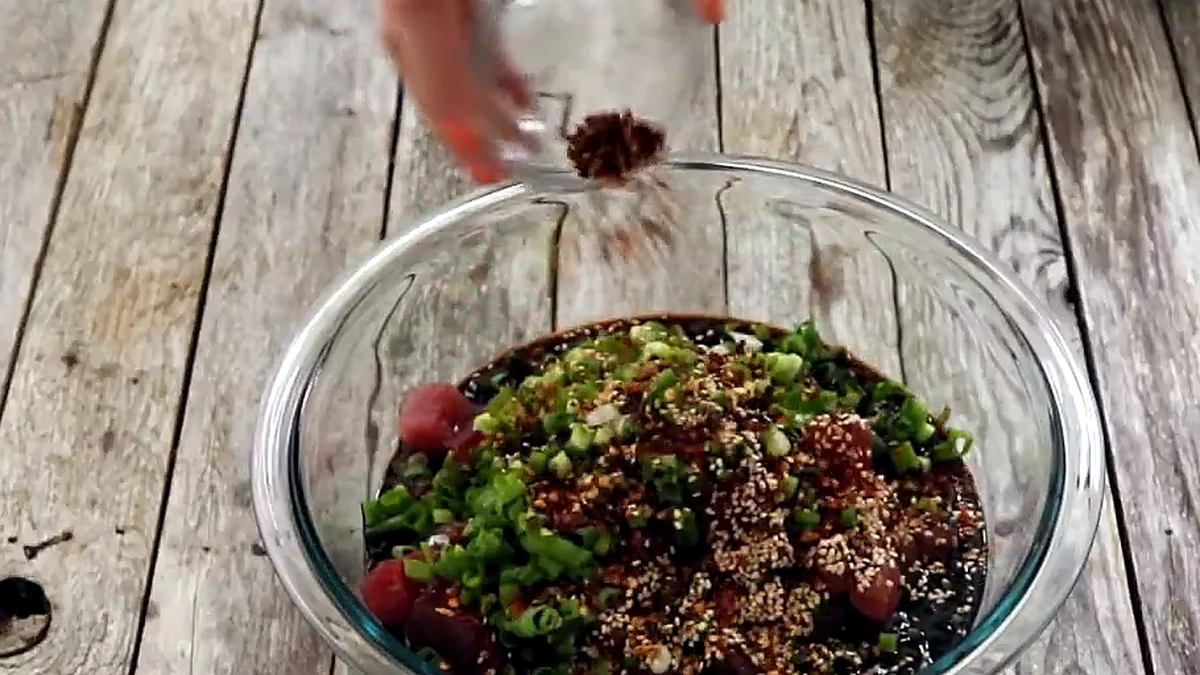 crushed red pepper added over tuna, green onions, and sesame seeds