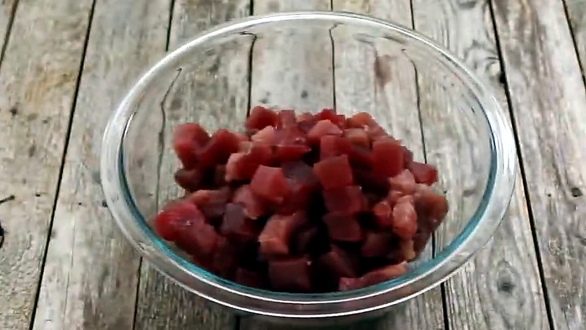 cubed fresh tuna in a glass bowl for ahi poke
