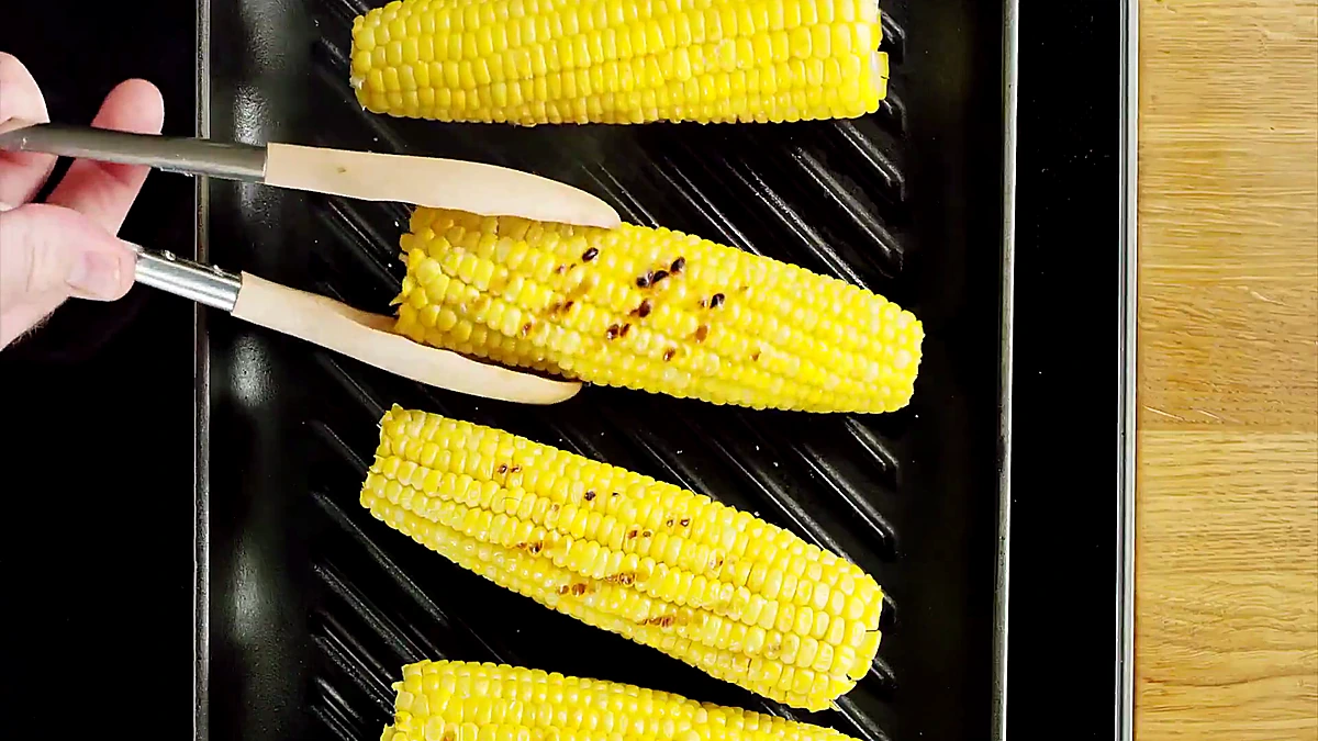 Corn with grill marks on a grill pan