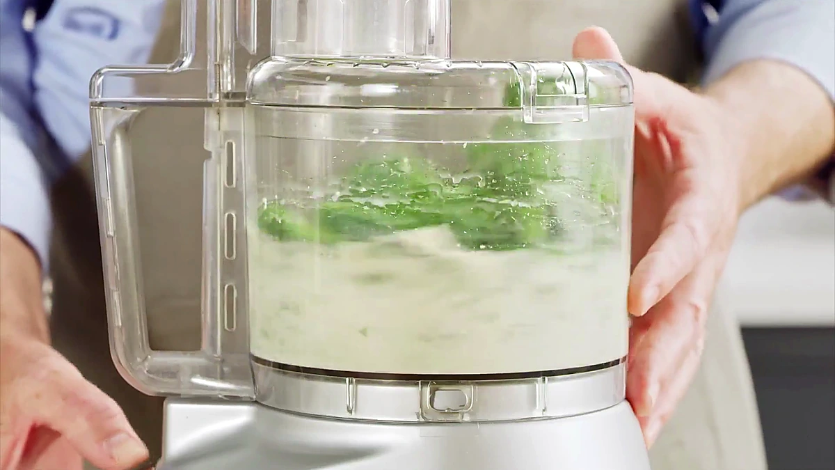 Aji verde sauce blending in the food processor