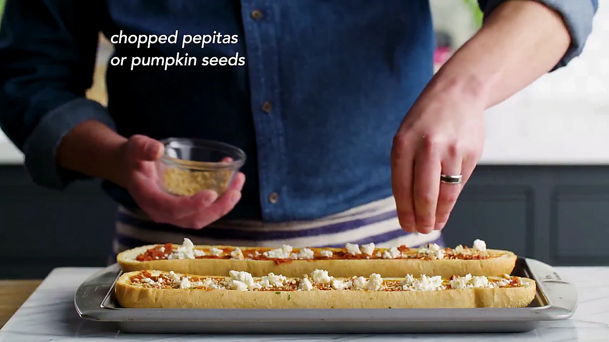 Pepitas sprinkled over feta tomato bread