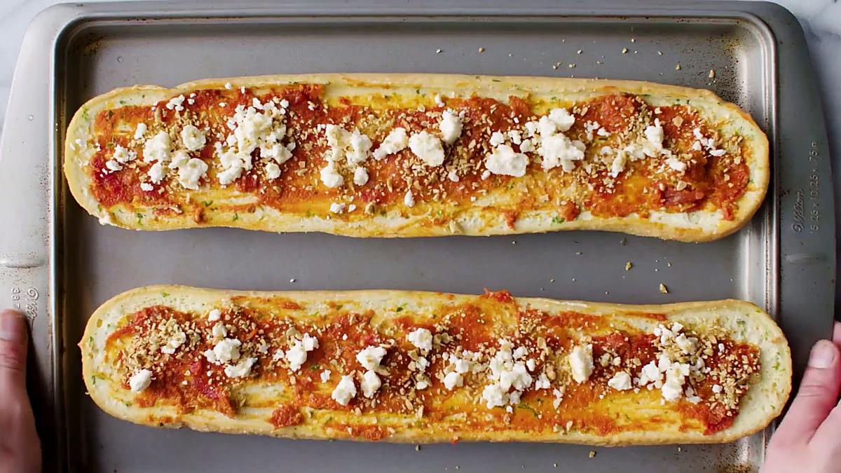 Feta tomato bread topped with tomato spread, feta, and pepitas
