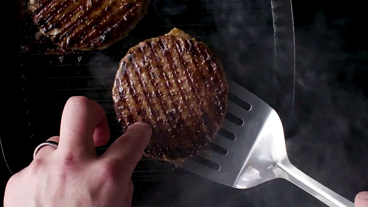 Turkey cutlet flipped on the grill pan