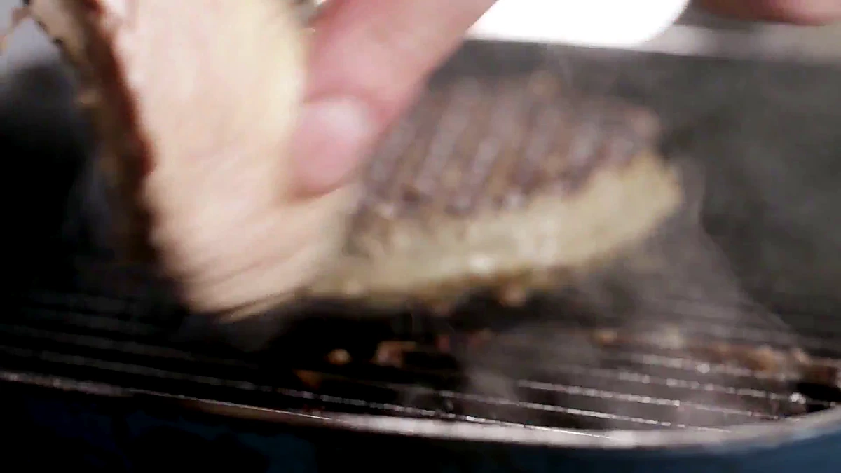 Turkey cutlet cooking on a grill pan