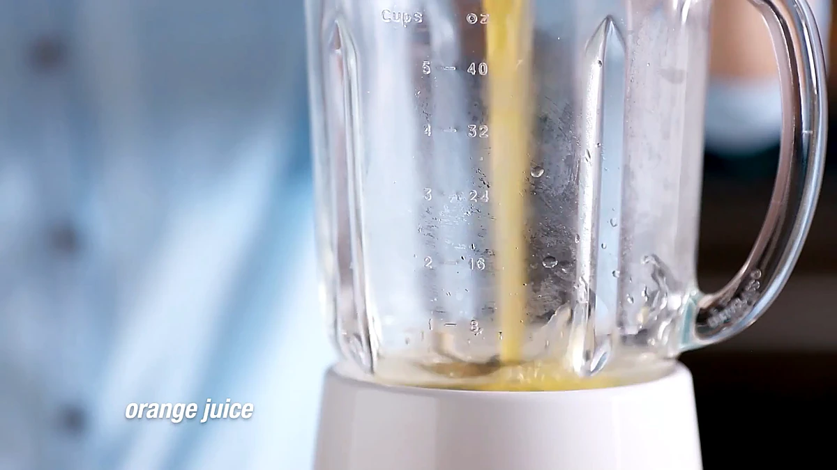 Orange juice poured into the blender