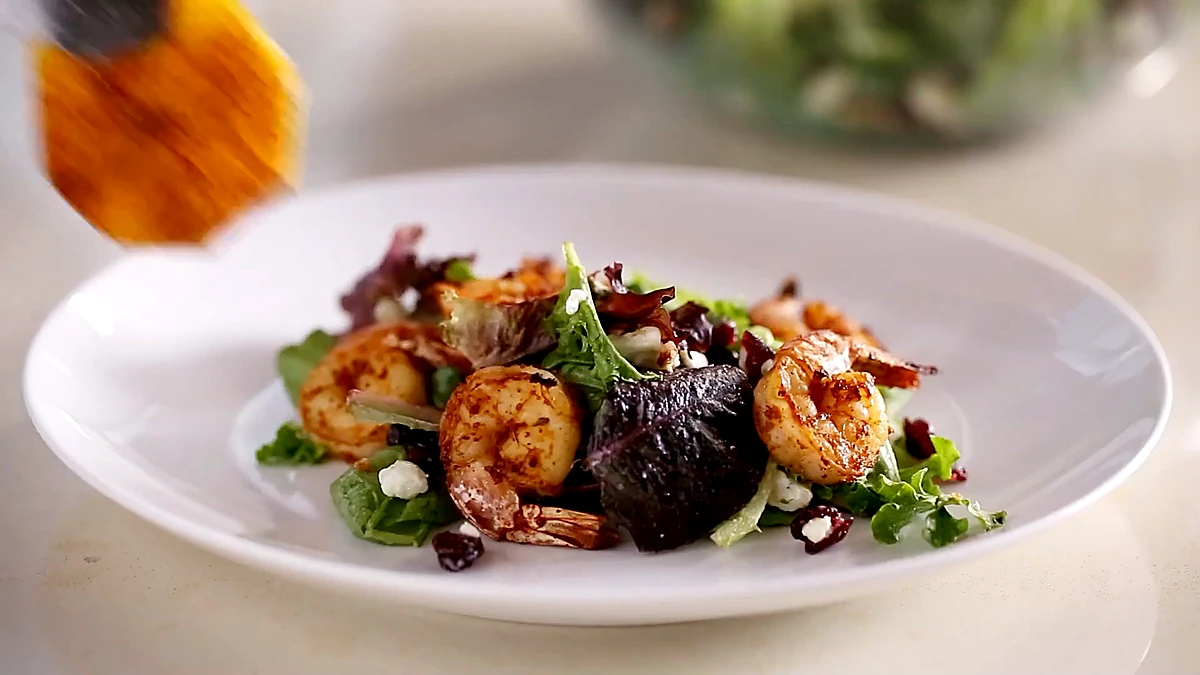 Blackened shrimp and greens plated together