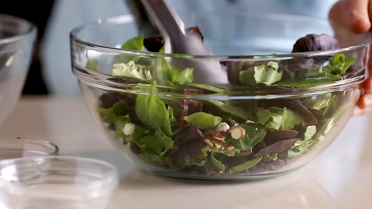 Salad tossed with almonds, cranberries, and goat cheese