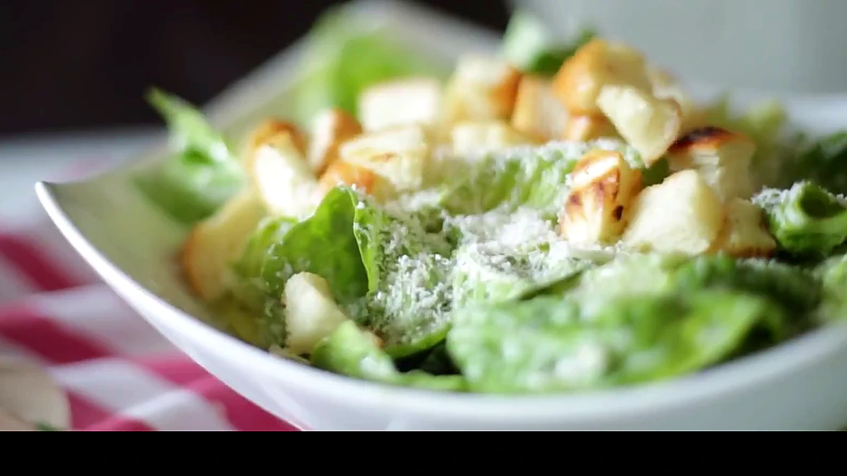 Finished Caesar salad with grilled shrimp and croutons