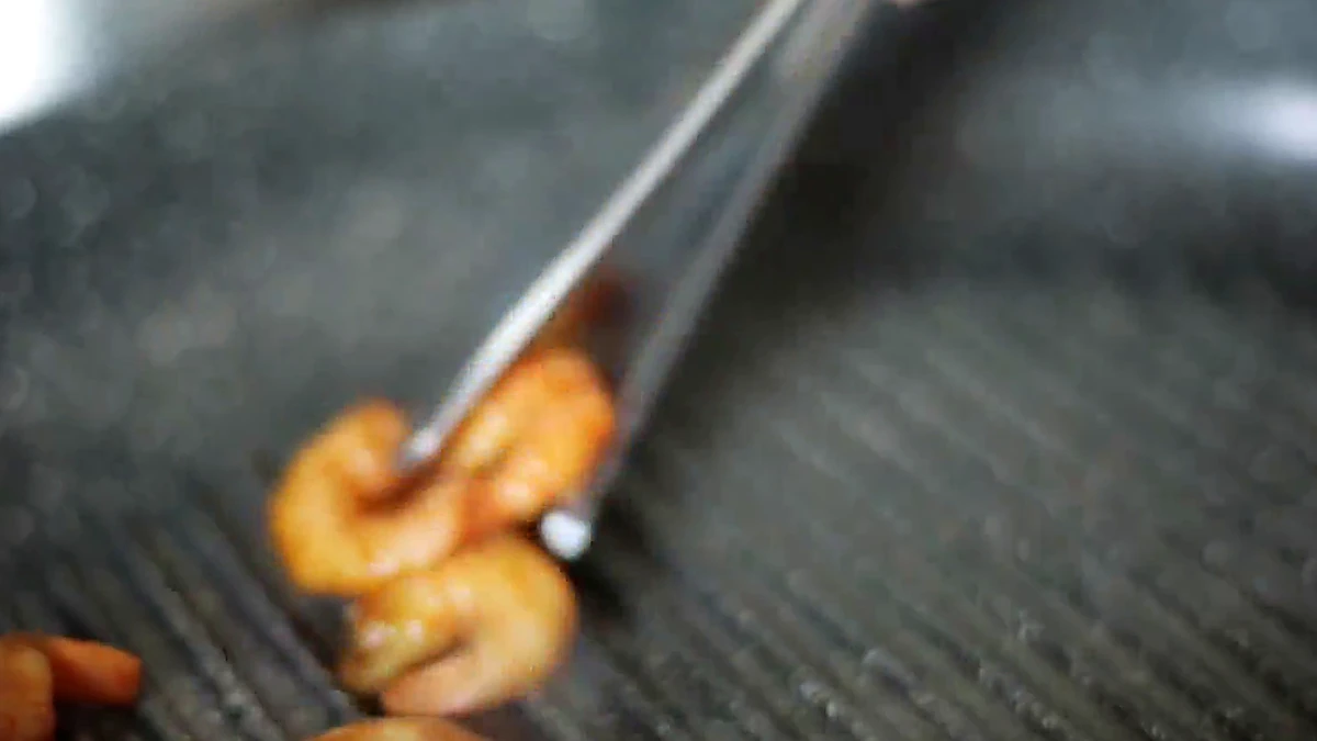 Marinated shrimp placed in a grill pan