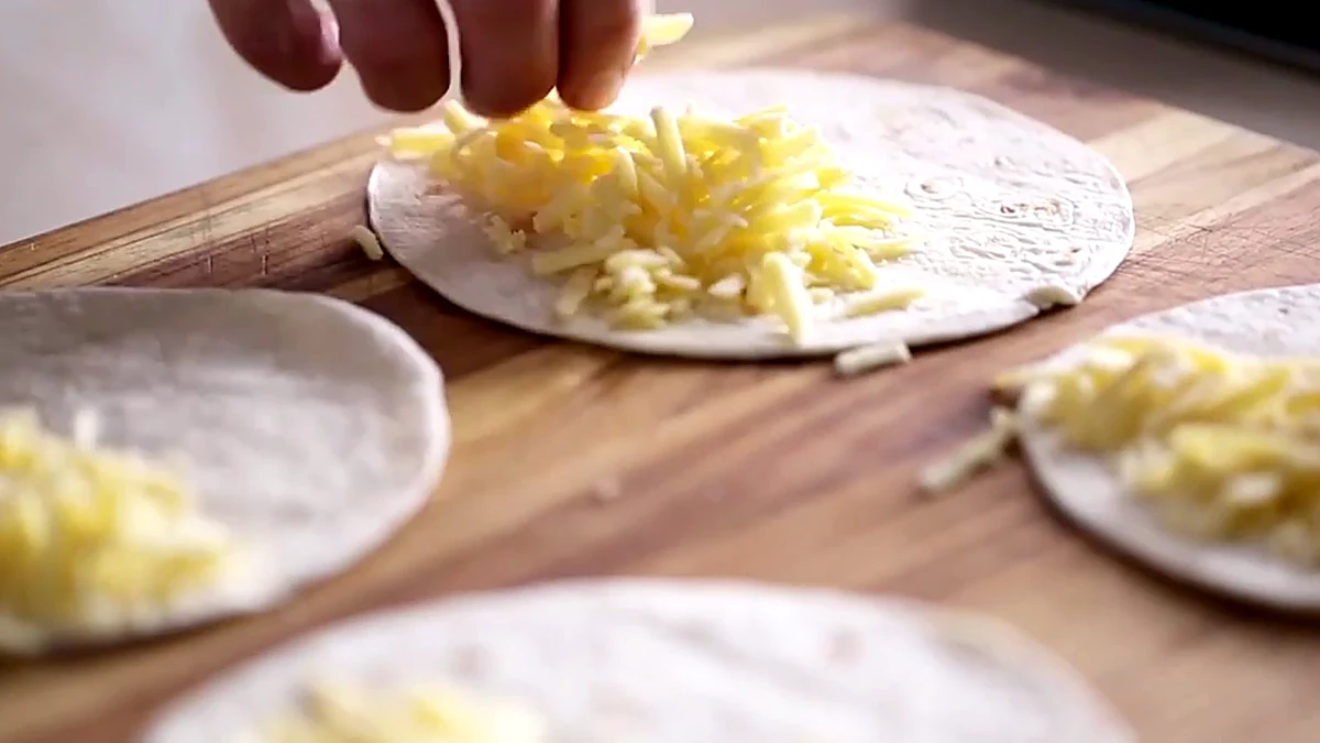 Cheddar added to tortillas for cherry quesadillas