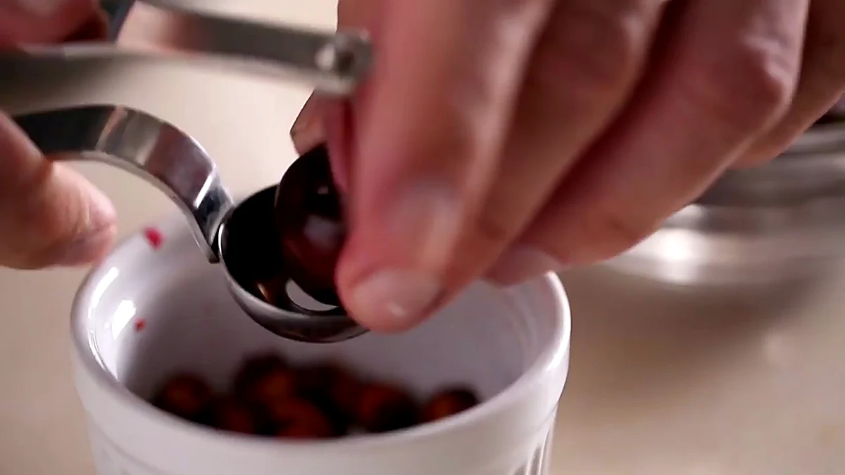 Fresh cherries being pitted