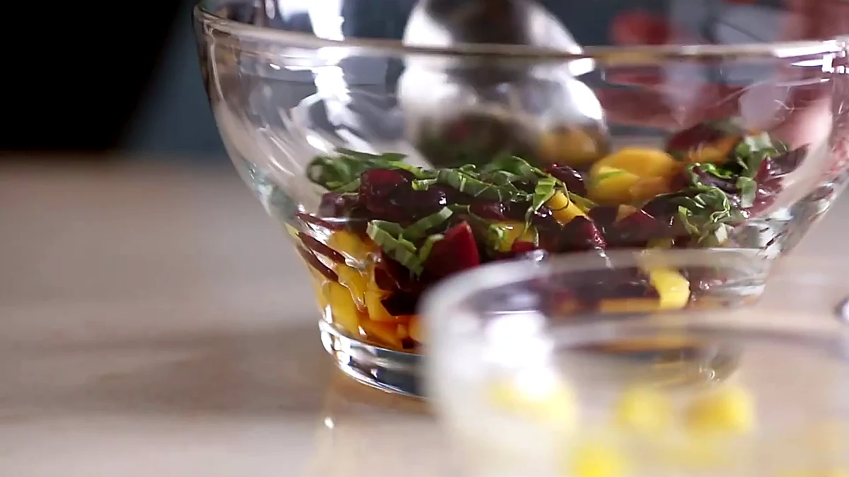 Mango cherry herb topping in a glass bowl